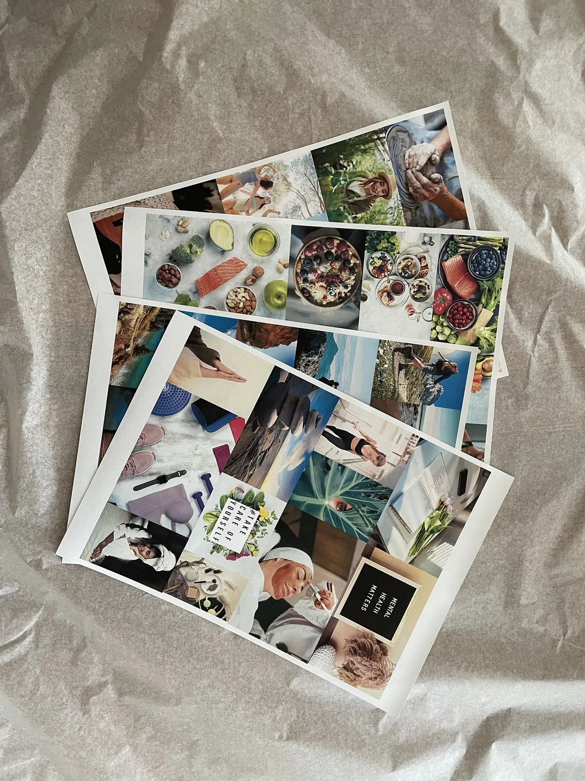 Sheets of printed photos for my vision board: healthy food, hiking, yoga and self-care pictures