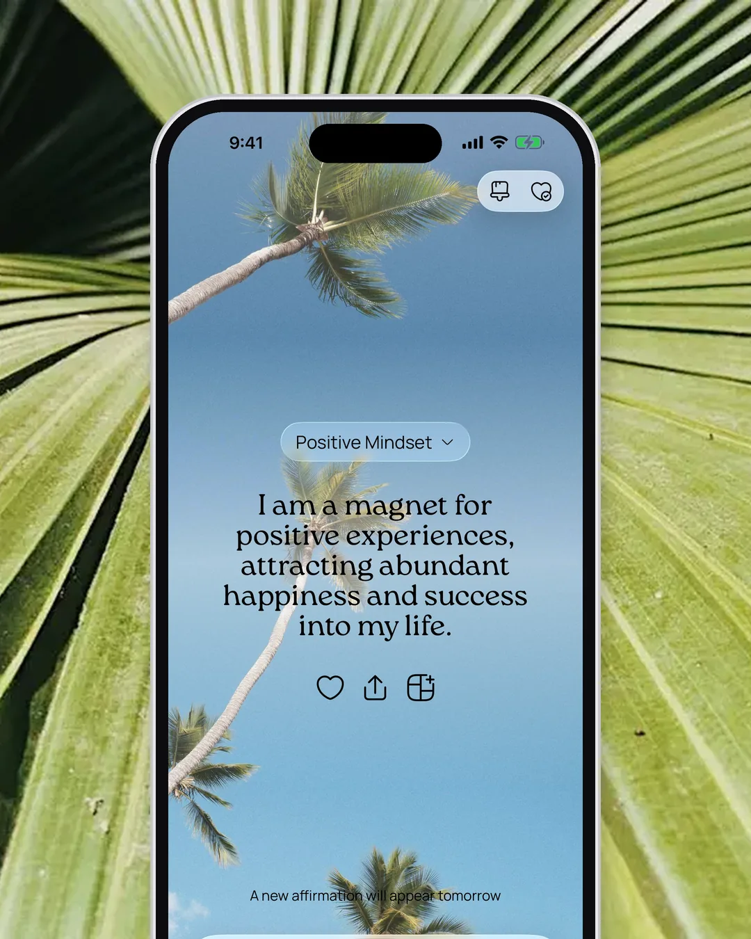 An affirmation in the VISIYA app over a palm-tree sky, framed by green palm leaves