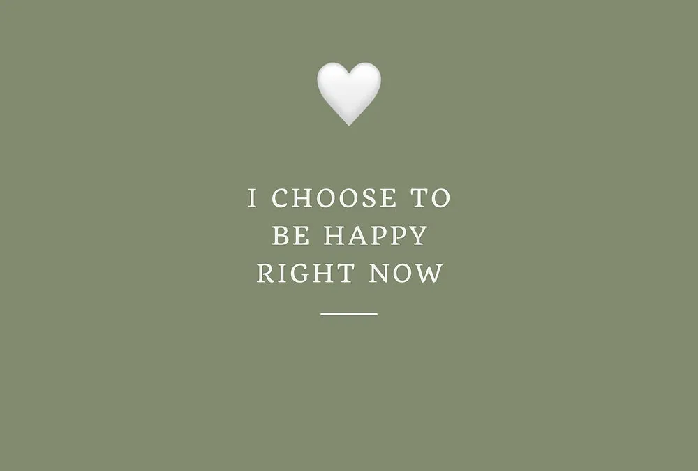 A calm sage-green vision board affirmation card with a white heart and positive lettering