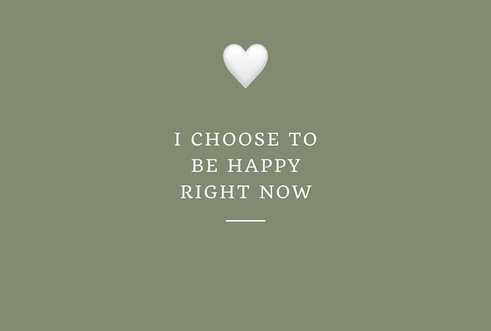 A calm sage-green vision board affirmation card with a white heart and positive lettering